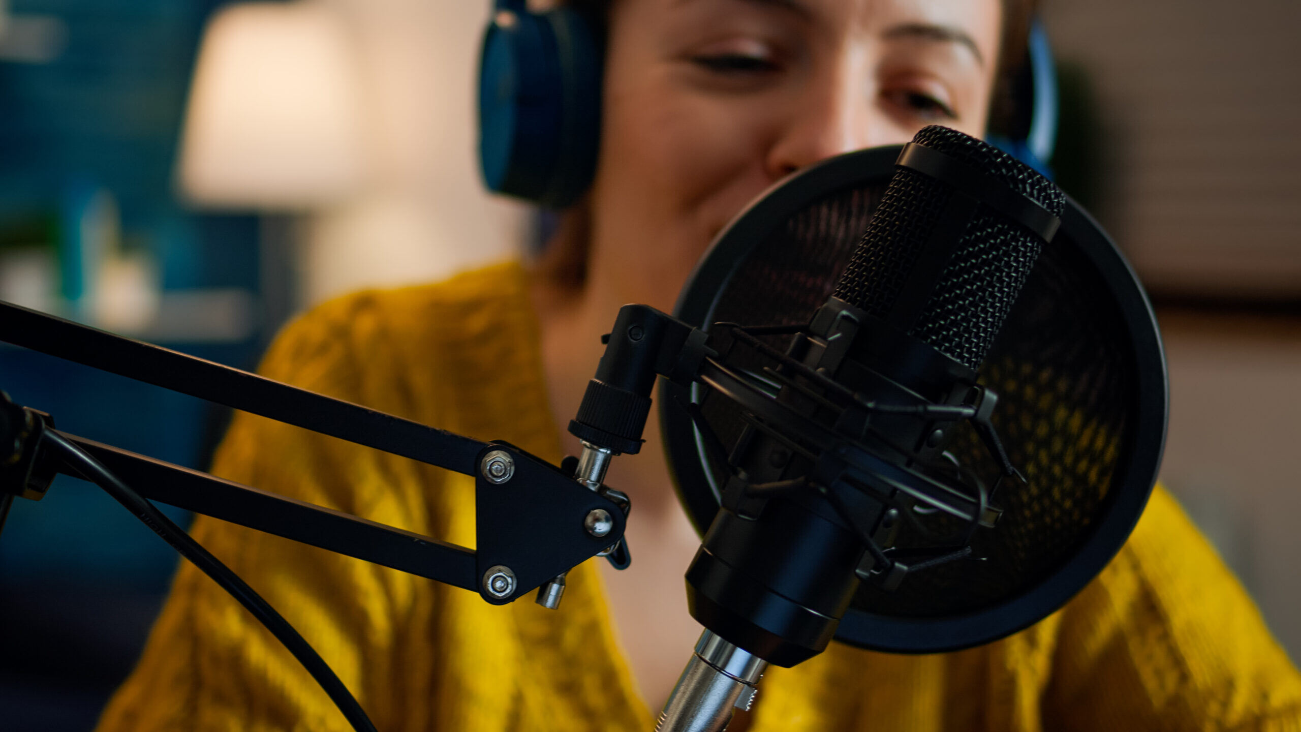 1Woman speaking into a microphone at a medical device webinar