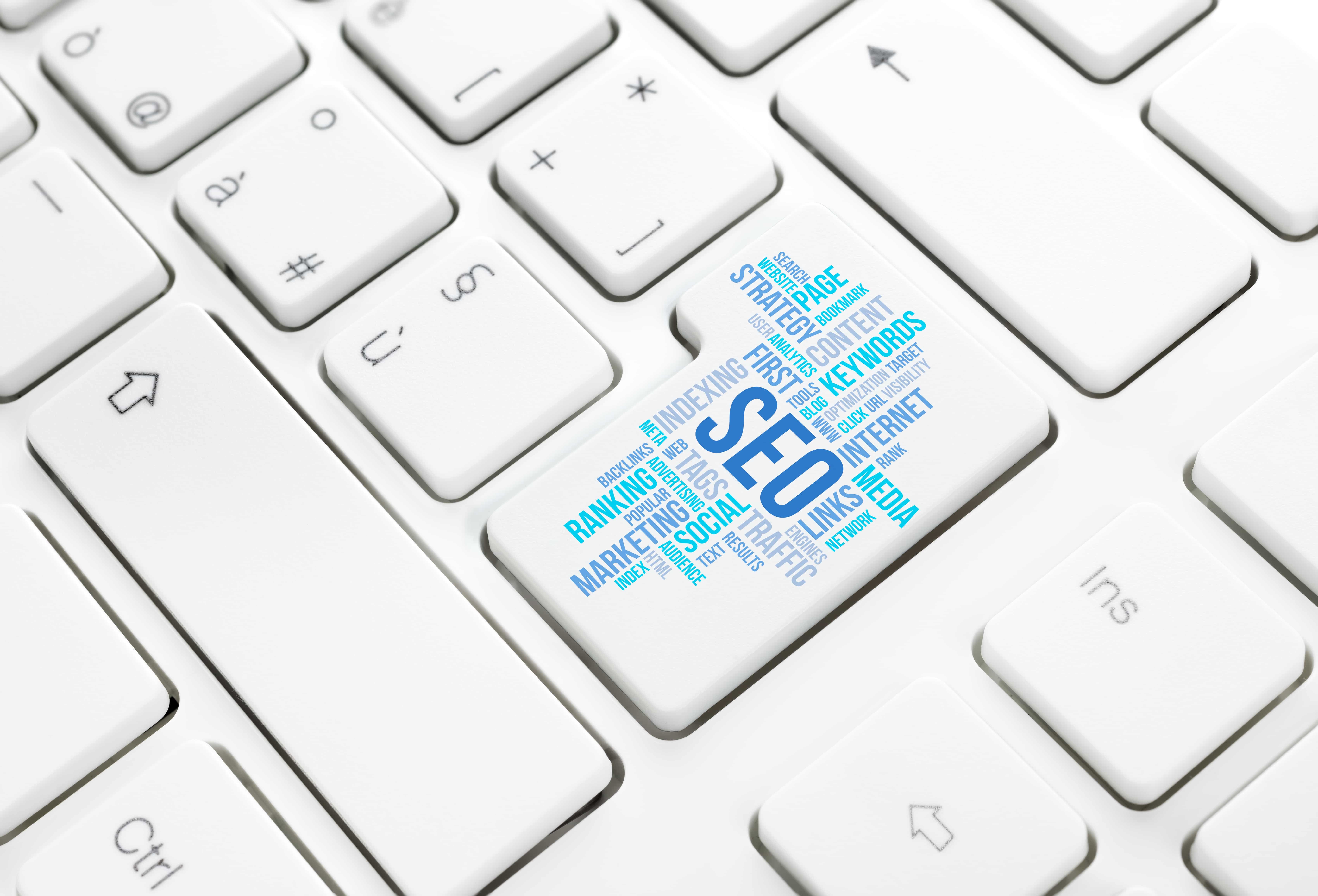 A keyboard close-up shows a key labeled SEO in a word cloud with terms like keywords, content, ranking, and traffic.