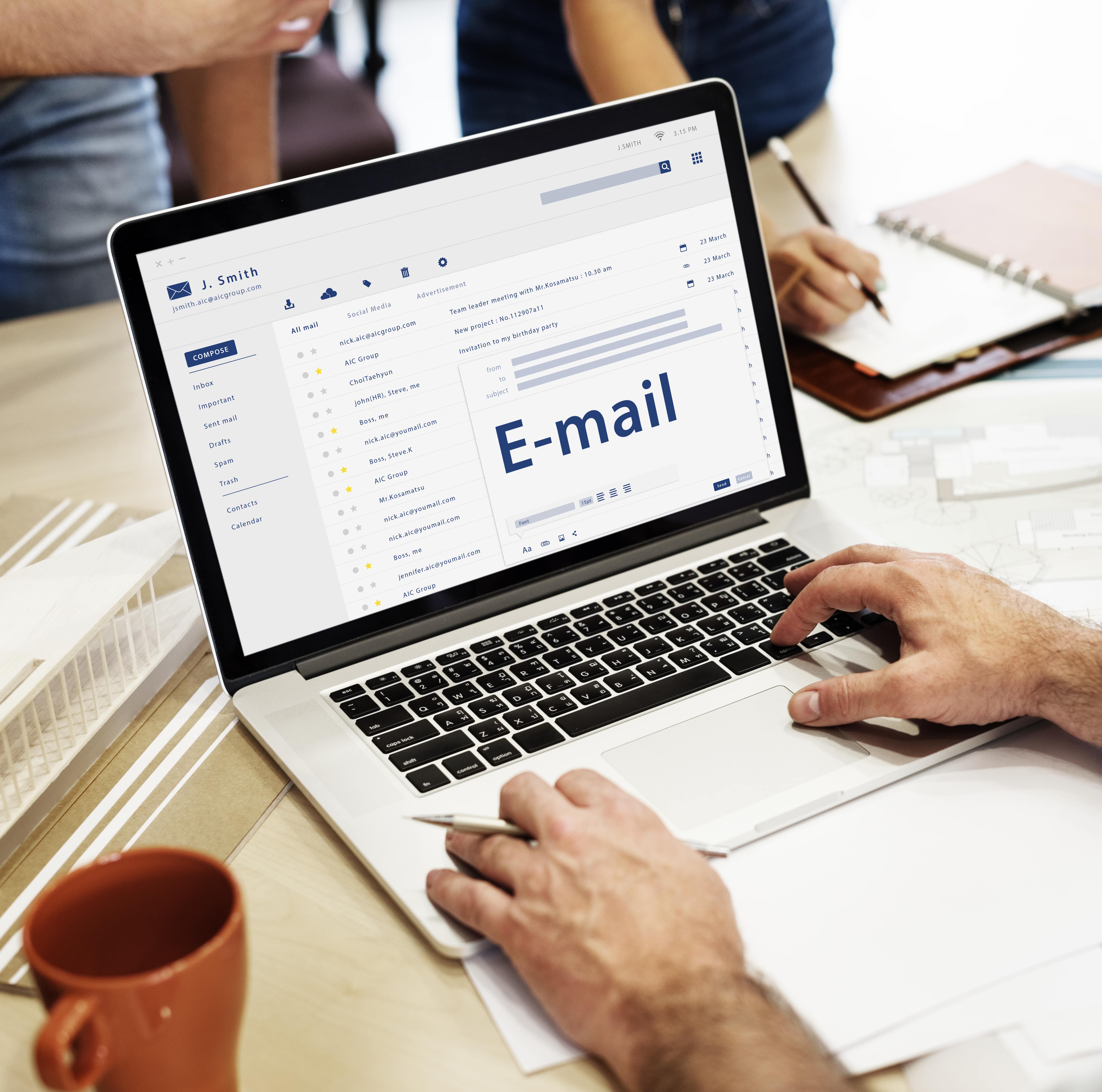 A medical device marketer looking at their email inbox during a meeting