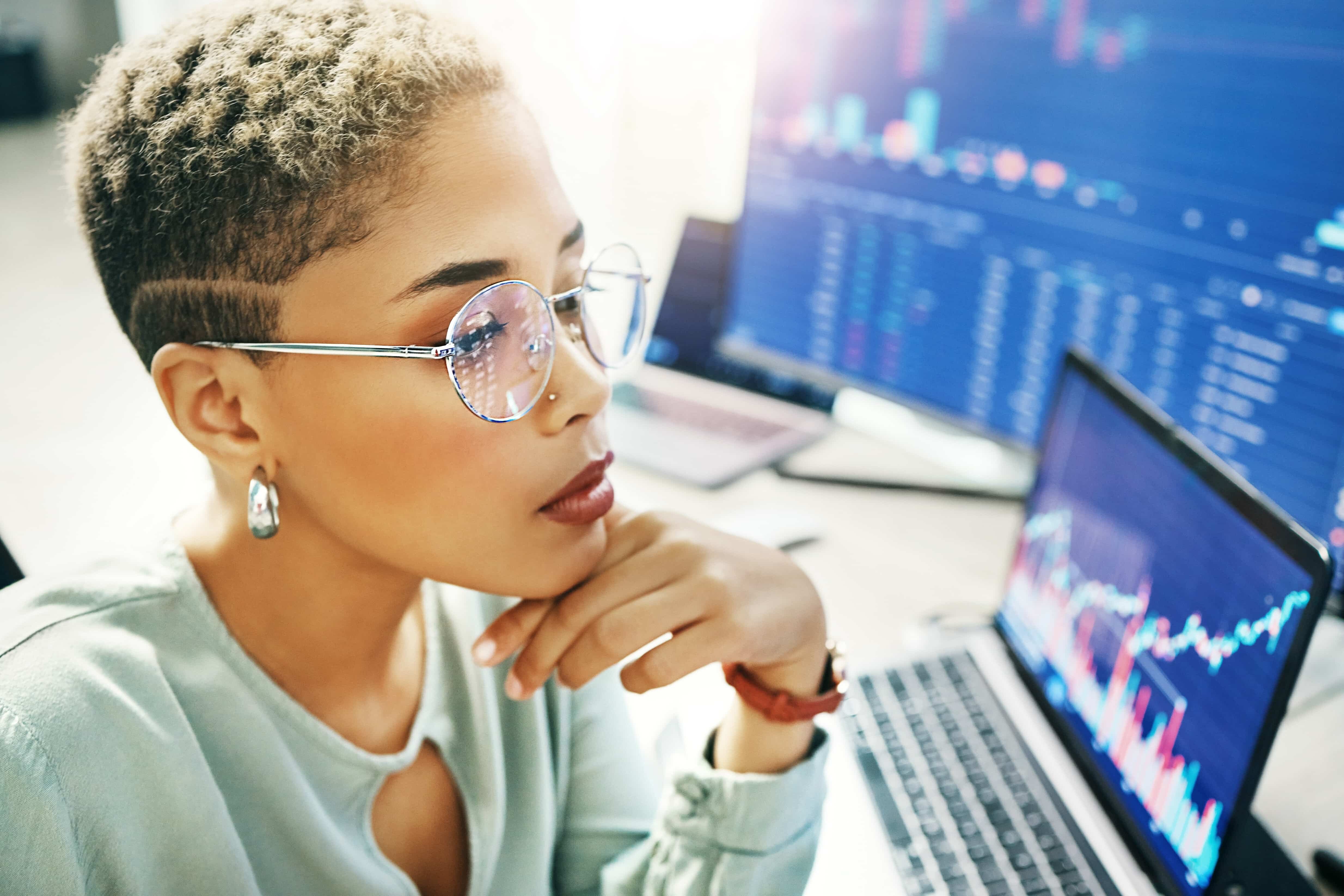 A woman looking at website statistics and incorporating them into the marketing campaign