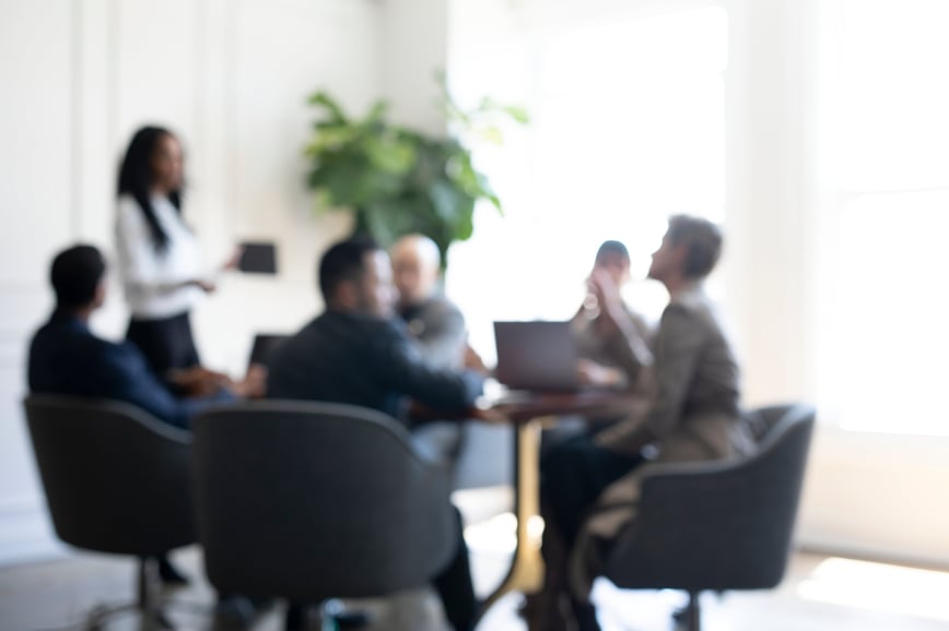 Blurry image of medical device marketers working on a plan to build trust with their audience-