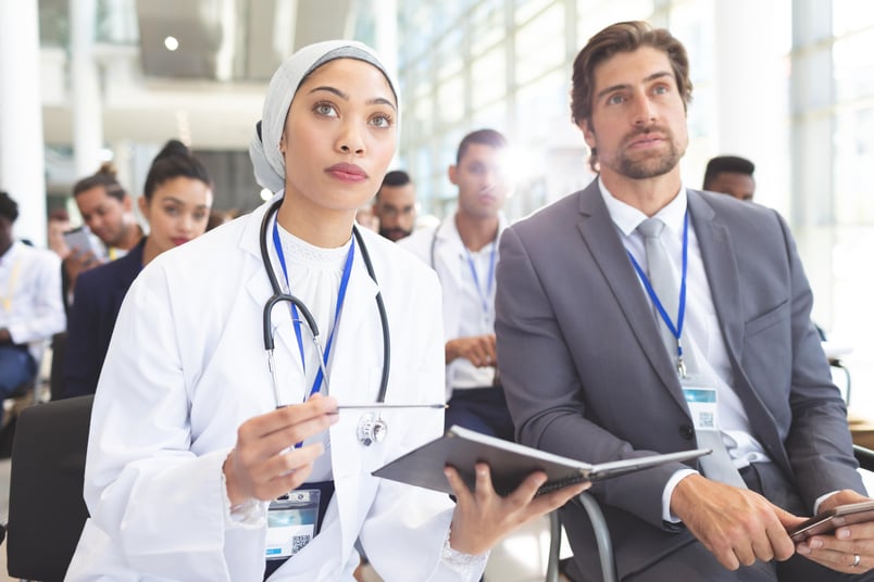 Doctor and business man at event