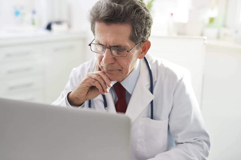 Doctor watching video on computer