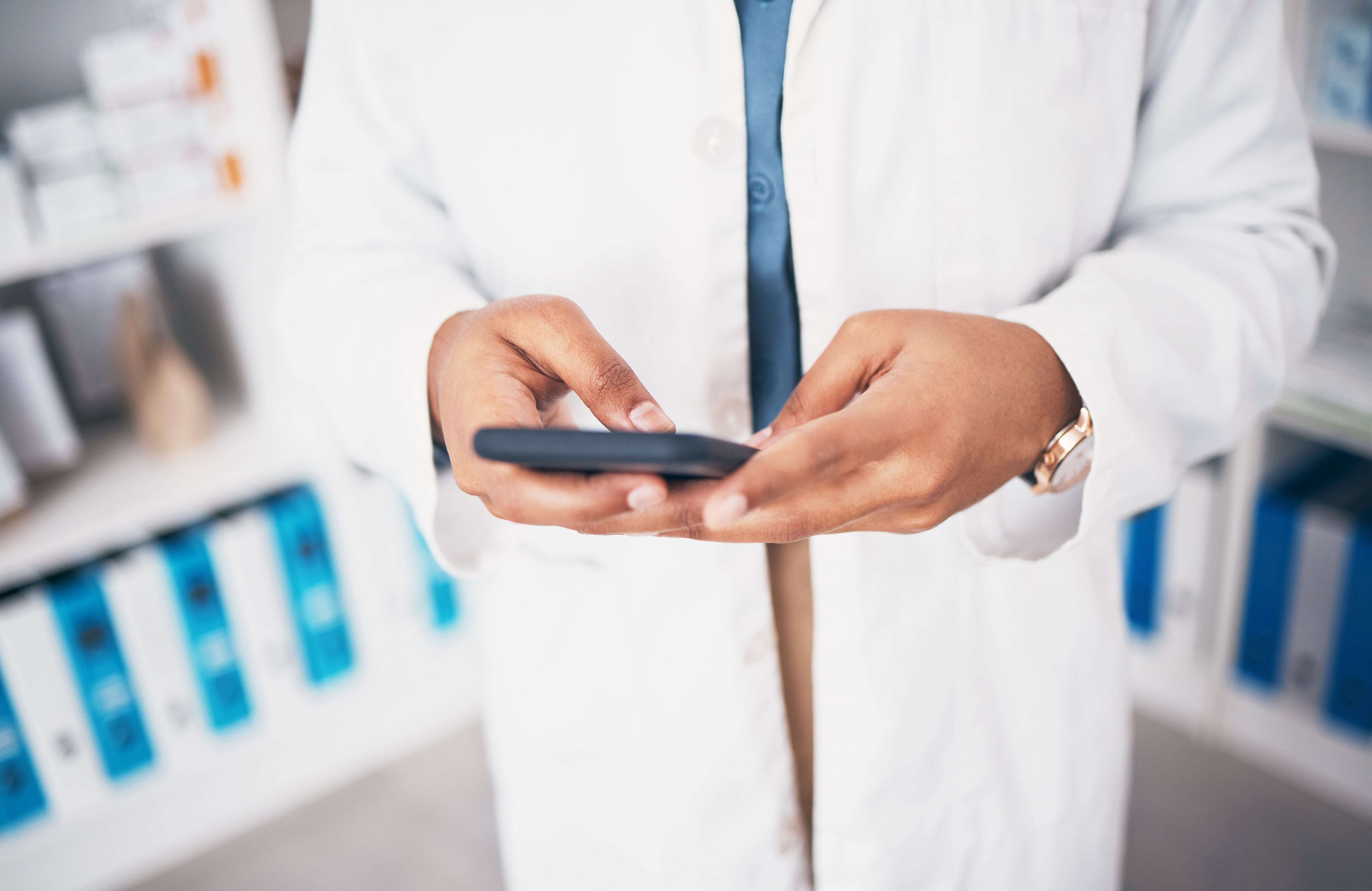 How to increase medical device social media engagement - a doctor scolling on phone