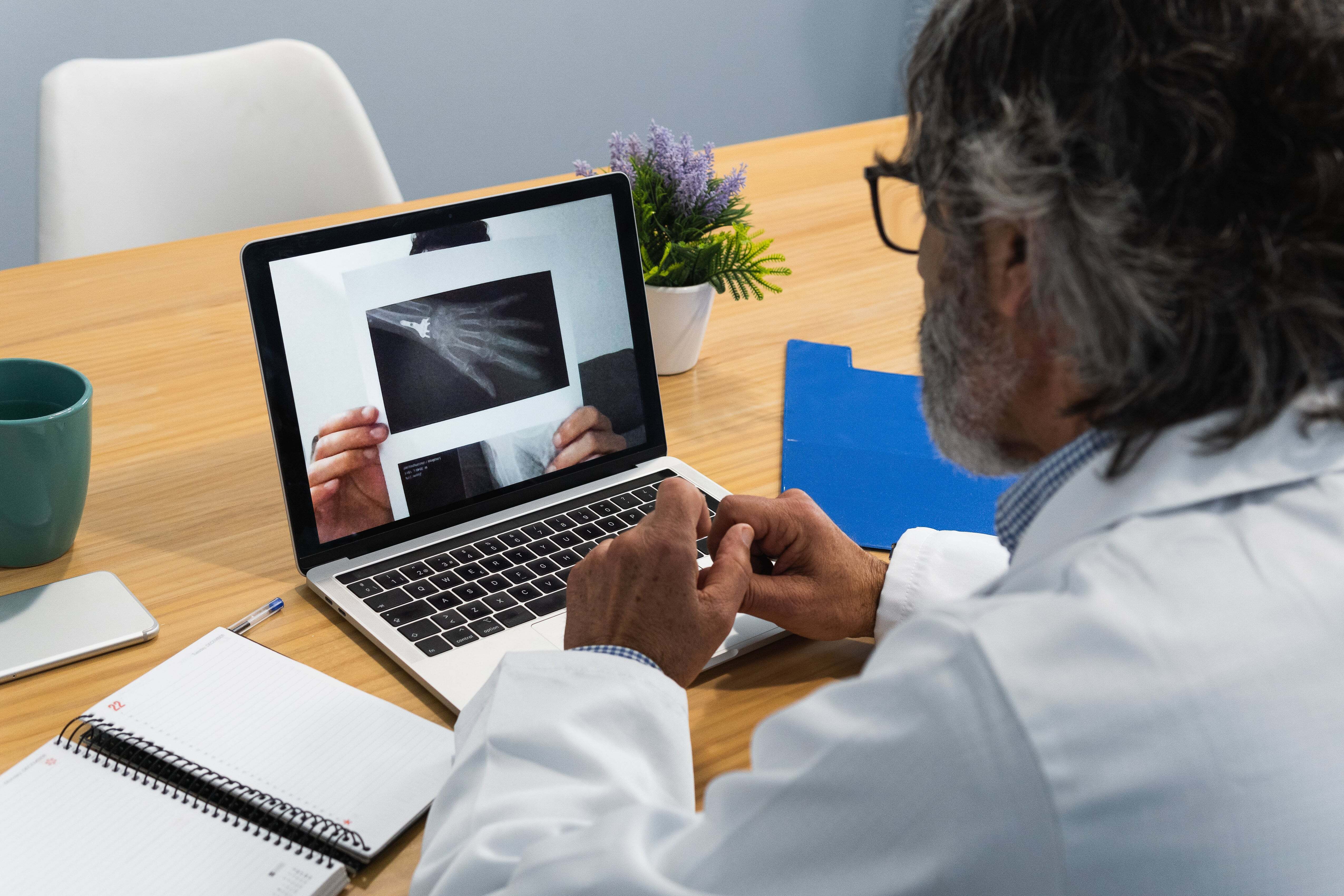 Doctor watching video on computer