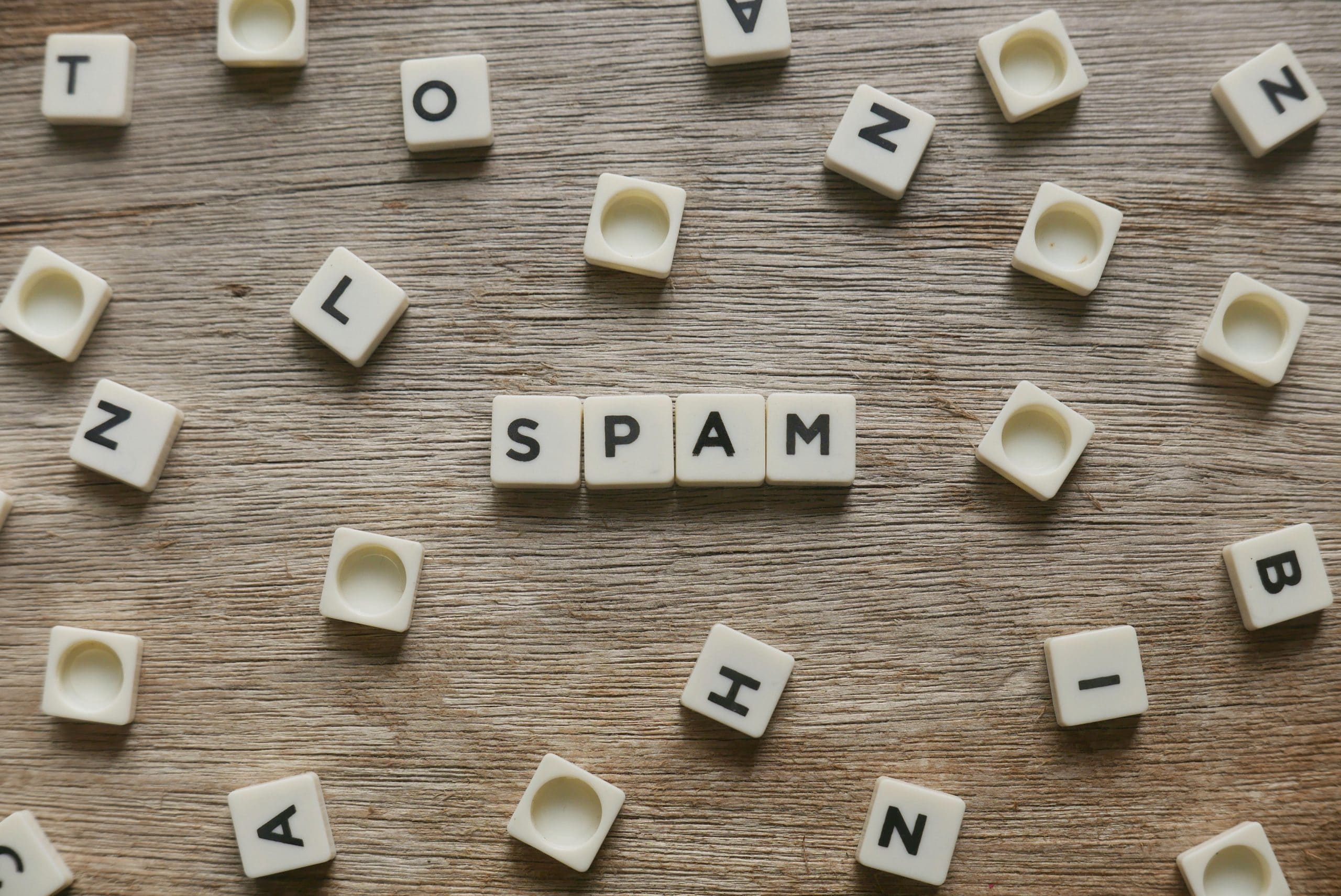 Board game tiles spelling out spam